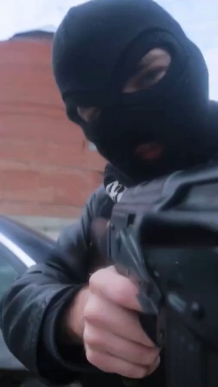 Masked Brother with a Glock