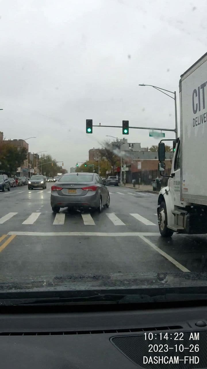 Truck Stops Inches From Sedan